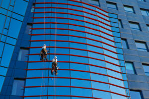 Workers cleaning windows in business center in scyscraper Stock Photo, ft. action & Blue - Envato